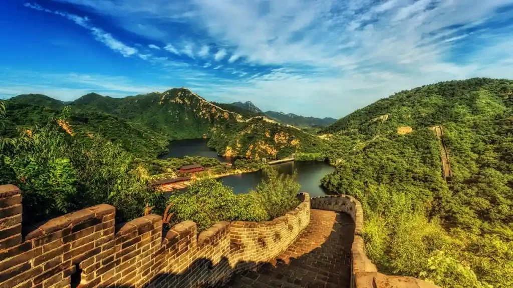 Aerial view of the Great Wall of China winding through mountains (wonders of the world)